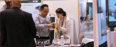 Schatz Center Senior Research Engineer Kristen Radecsky discusses technical points with a solar product designer.