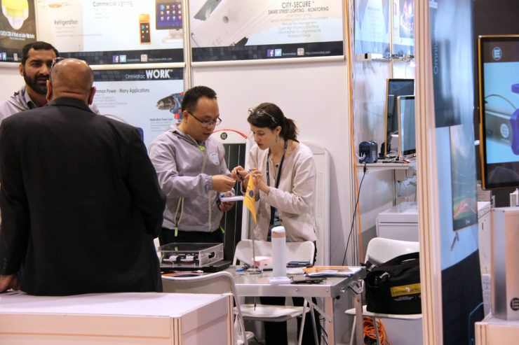 Schatz Center Senior Research Engineer Kristen Radecsky discusses technical points with a solar product designer.