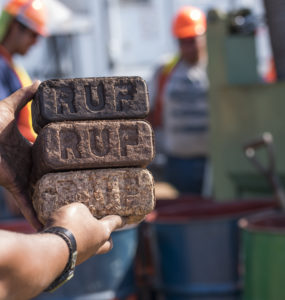 A stack of three briquettes; different colors represent combinations of temperature and time.