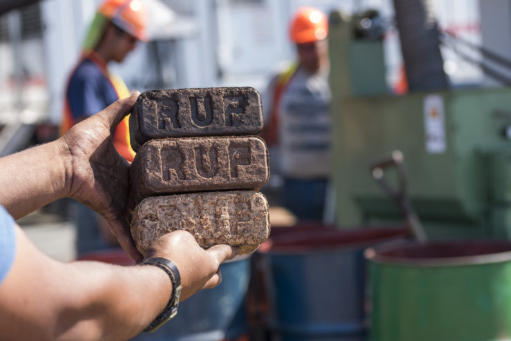 A stack of three briquettes; different colors represent combinations of temperature and time.