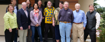 Advisory Board members stand outside the West Wing.