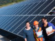 Three women stand at the foot of the Blue Lake Rancheria solar array.