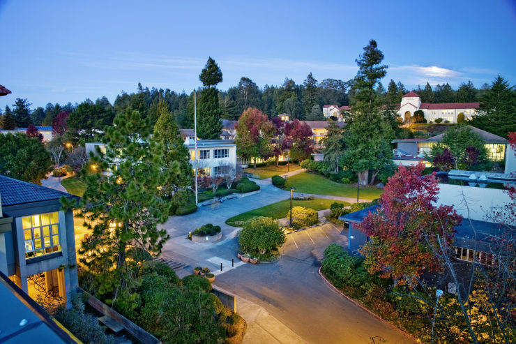 The HSU library, Siemens Hall and JVD courtyard is illuminated by nightlights, with Founders Hall in the distance