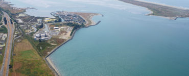 An aerial photo of the Humboldt Bay Generating Station, across from the south peninsula of Humboldt Bay