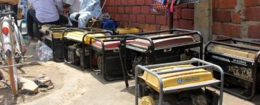 Backup generators line brick market walls
