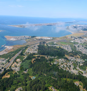 An aerial view of Humboldt Bay and the harbor jetties, from the southeast