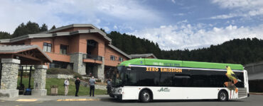 A hydrogen bus pulls up to College of the Redwoods