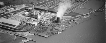 Black and white aerial photo of a power plant and lumber mill on Humboldt Bay