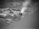 Black and white aerial photo of a power plant and lumber mill on Humboldt Bay